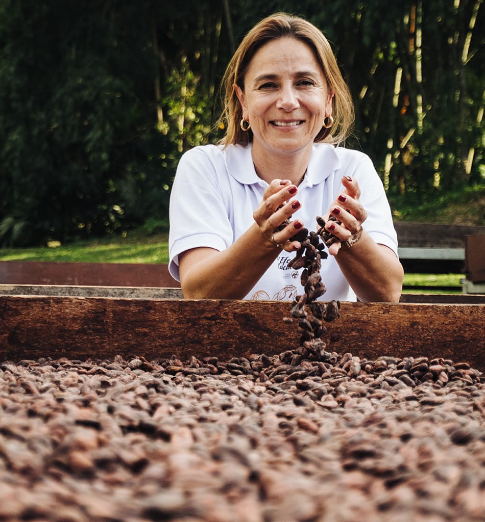 Phot shows Julia Ocampo, Luker Chocolate’s VP of Cacao Sourcing and Sustainability shaking cocoa beans