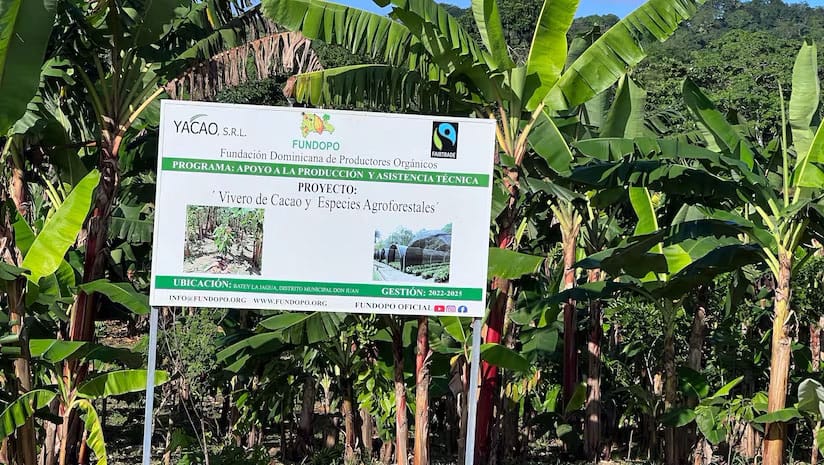 Image hows a sign for Pronatec and its Fairtrade Mark at one of its cocoa farms in the Dominican Republic. Image: cocoaradar.com