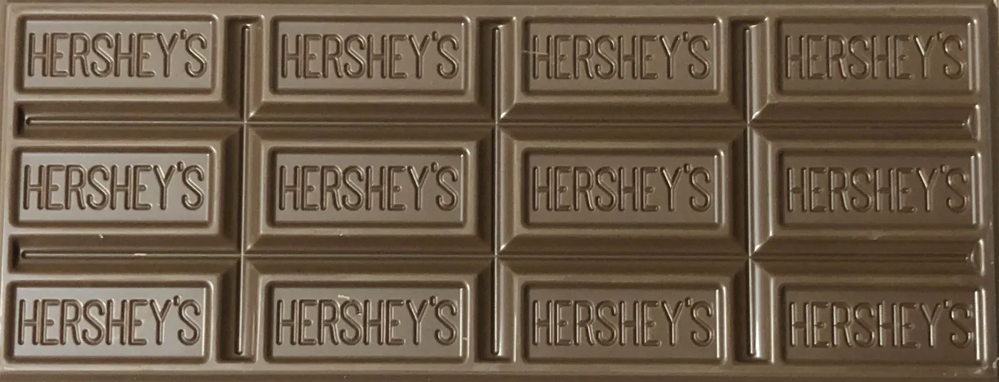 Image shows rows of chocolate bars made by Hershey.
