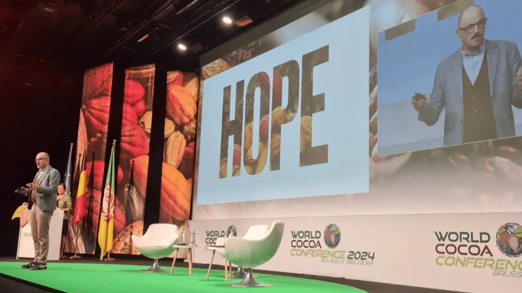 Image shows Antonie Fountain speaking at the World Cocoa Conference in Brussels, 2024