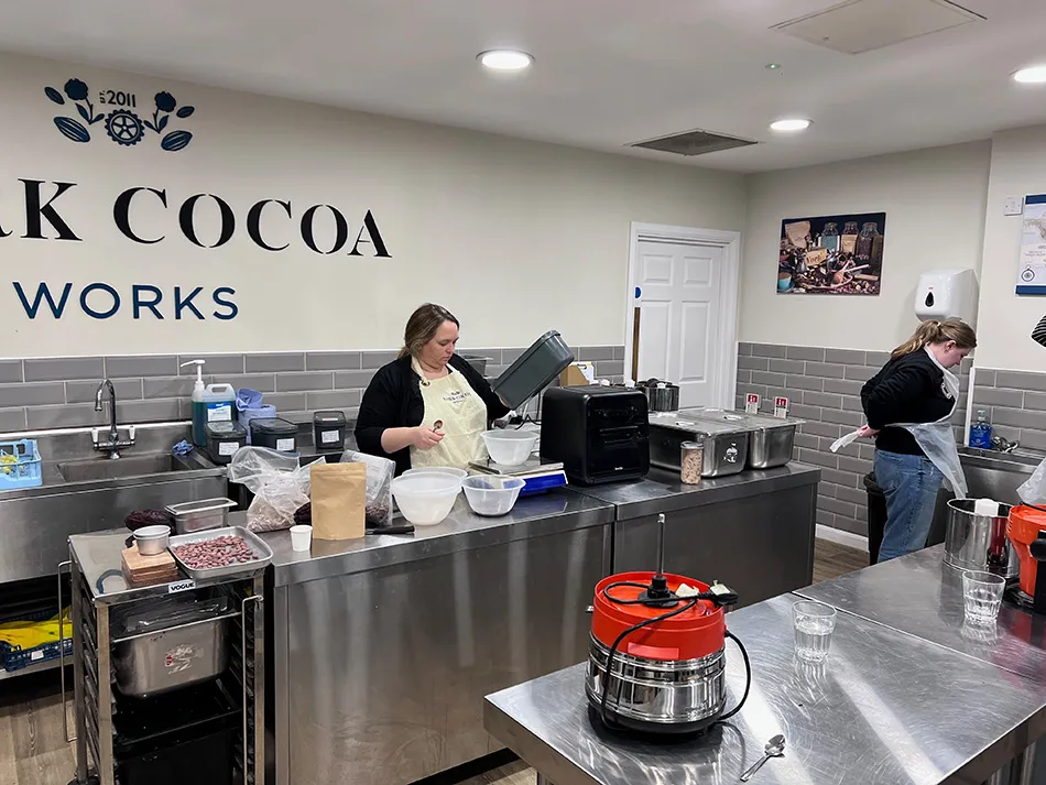 Image shows Sophie Jewett preparing a Bean to Bar Masterclass at York Cocoa Works. 
