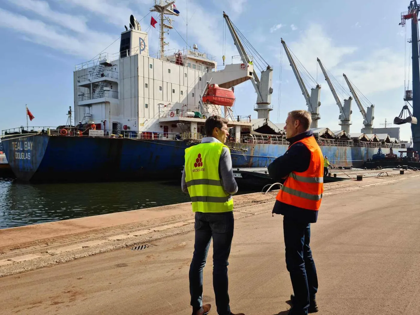 Image shows a container ship unloading at Port of Amsterdam