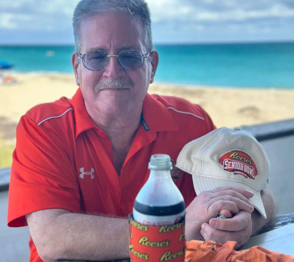 Image shows Brad Reese proudly wearing the Reese's brand at the beach.