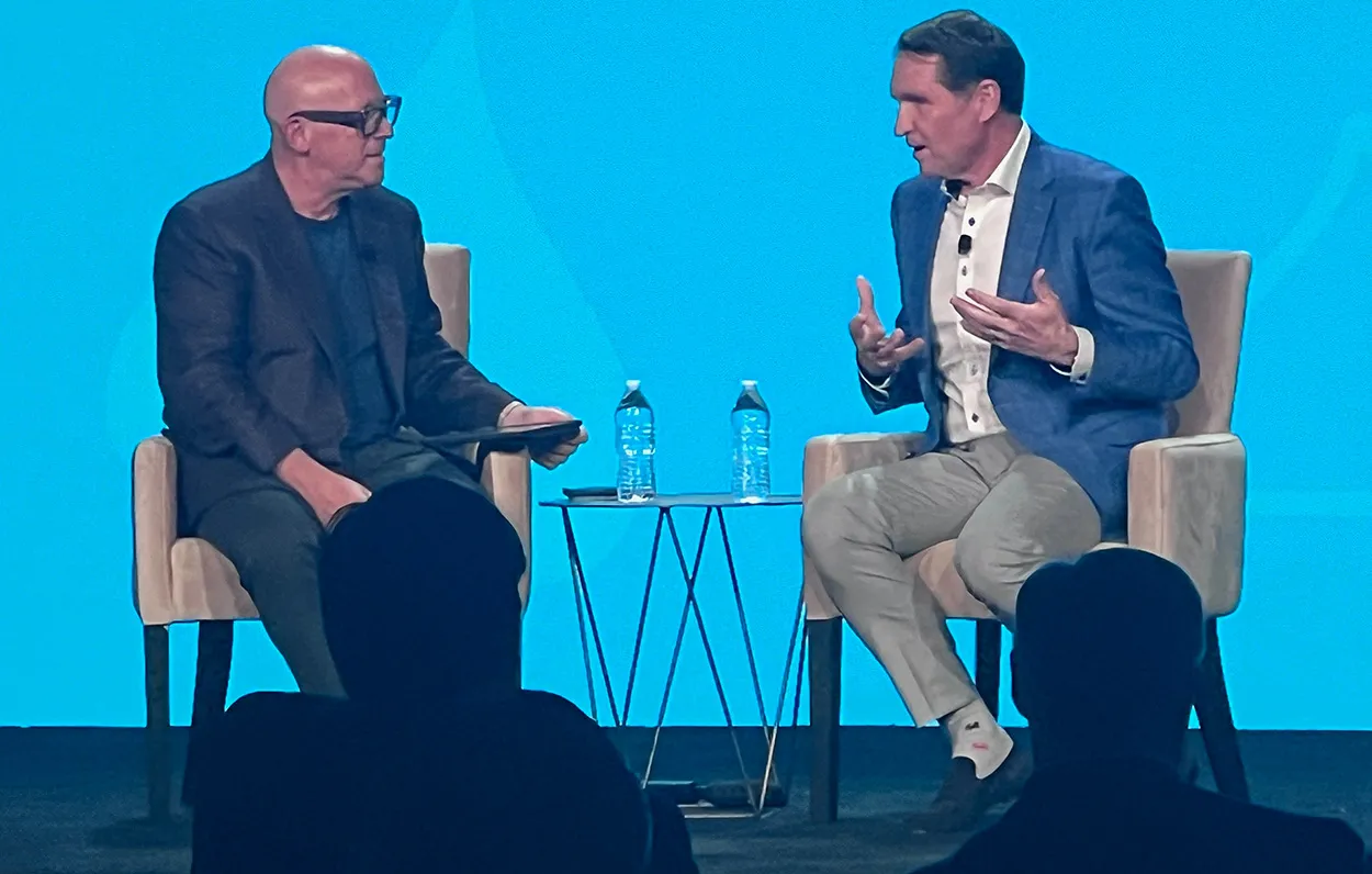 Image shows Hershey CEO Kirk Tanner (right) in conversation with Mark Jeffries at the NCA's SOTIC